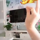 TikTok AR Effect tracks different hand gestures to generate a mini augmented reality music video set