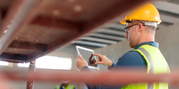 Architect using a tablet at construction site