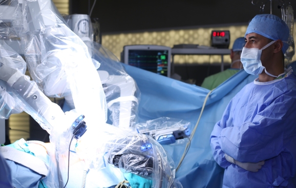 Medical robot. Medical operation involving robot. Robotic Surgery. Manipulators performing surgery on a man