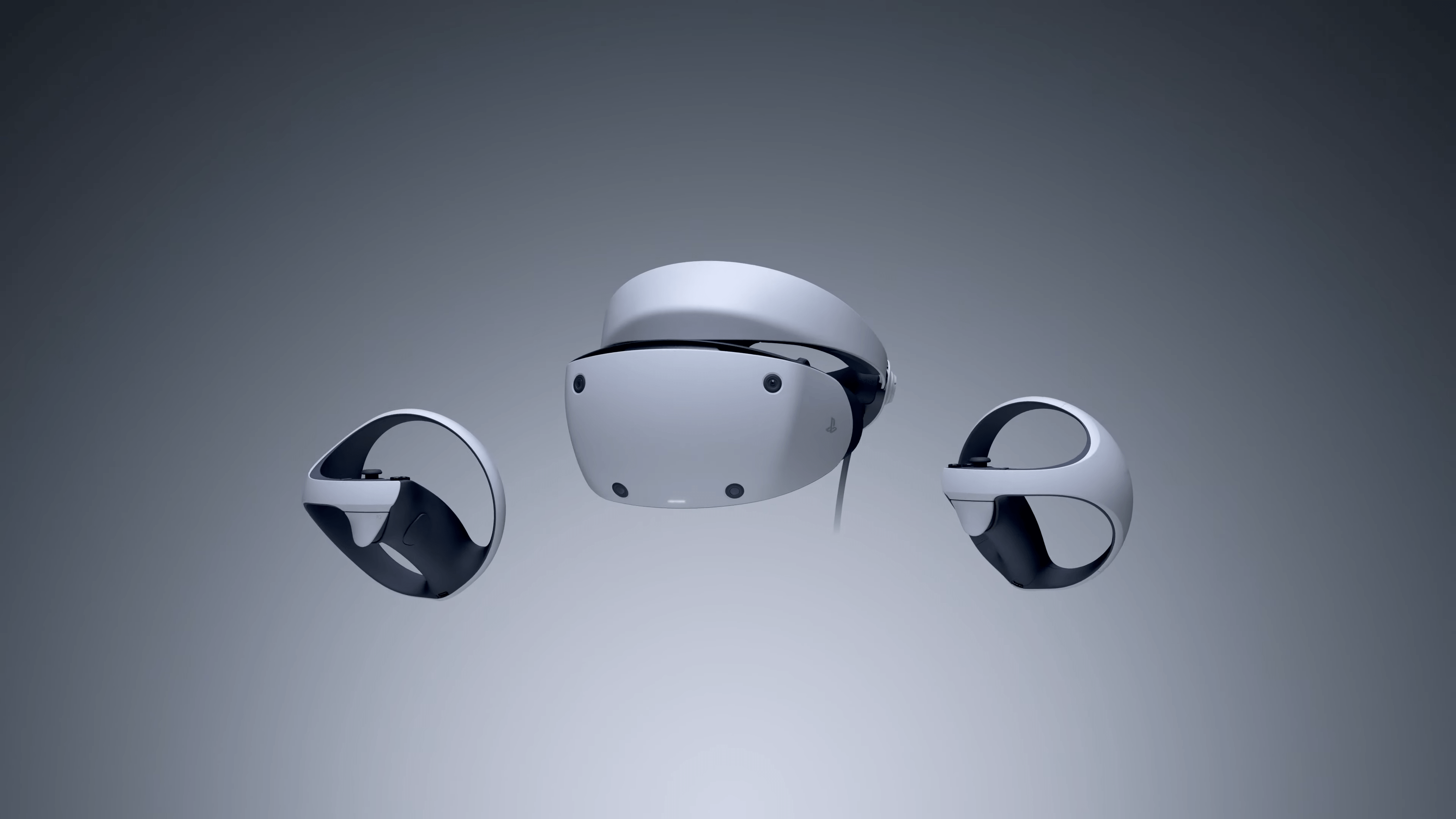 Playstation VR 2 und Sense-Controller vor grauem Hintergrund.